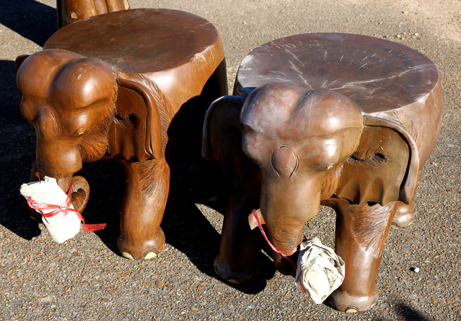 651a - 2 teakwood elephant stools, tusk in bags