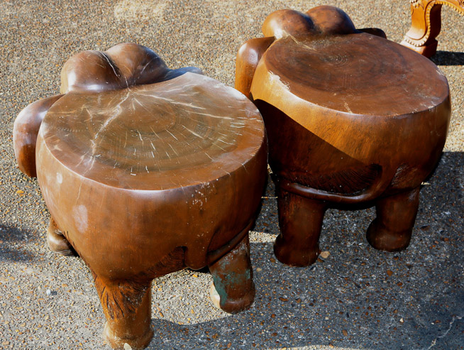 651c - 2 teakwood elephant stools, tusk in bags