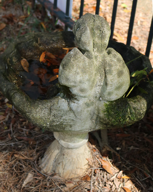 413c - Small concrete bird bath with an angel