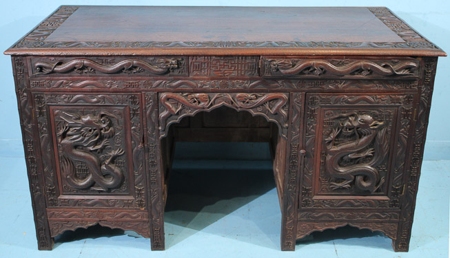 044a - Heavily carved walnut Oriental desk with dragons