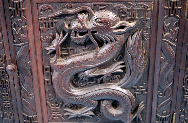 044e - Heavily carved walnut Oriental desk with dragons