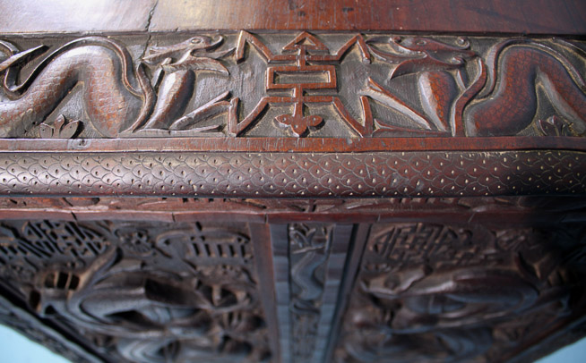 044g - Heavily carved walnut Oriental desk with dragons