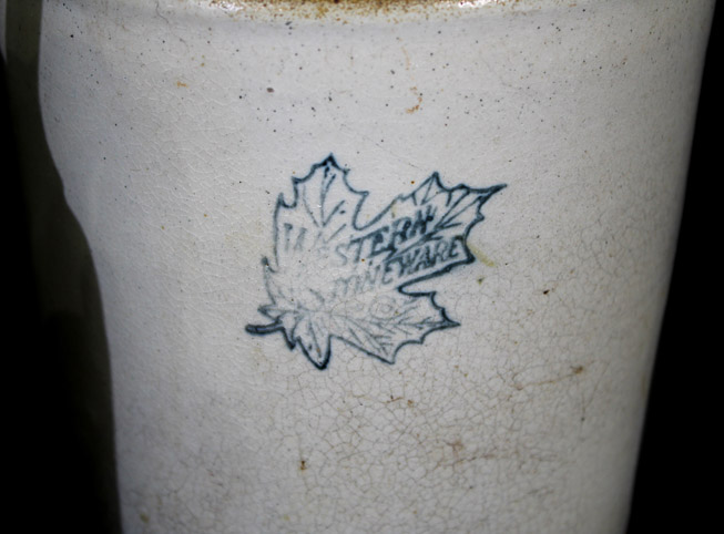 374b - 4 crock jugs, one has maple leaf