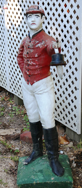 305a - Concrete lawn jockey with light, needs repair